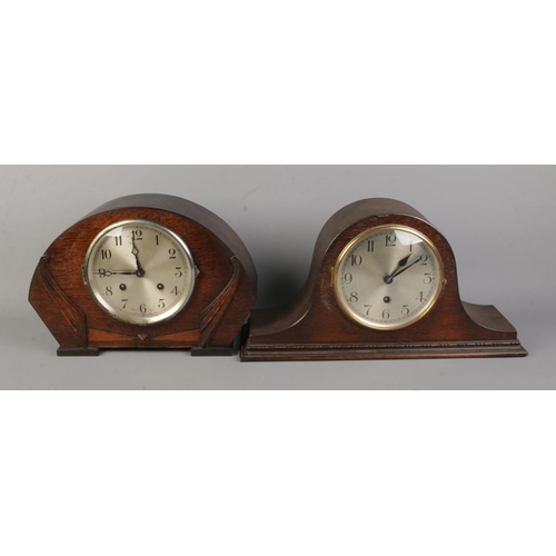 68 - Two oak cased mantle clocks to include dome top example. Both with pendulums.