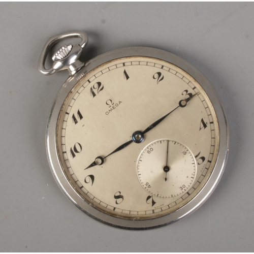 453 - A white metal Omega pocket watch. Having Arabic numeral markers and subsidiary seconds.