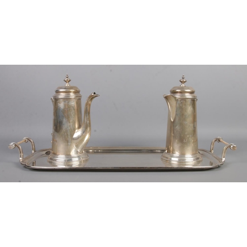 472 - A George VI silver three part coffee set. Includes tray, coffee pot and hot water pot. Assayed Sheff... 