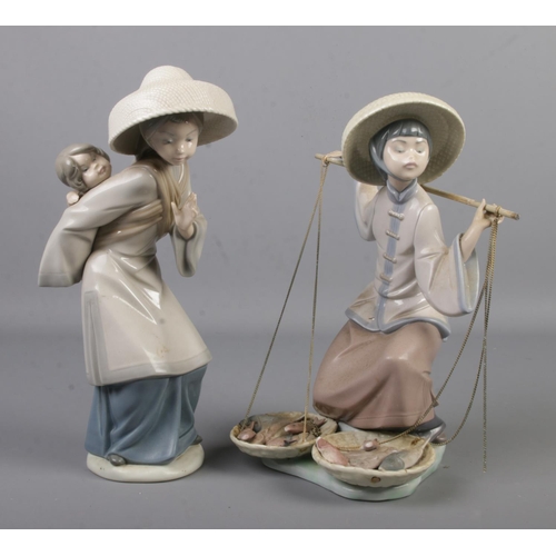 476 - Two Lladro ceramic figures; Fish a Plenty and My Precious Bundle.