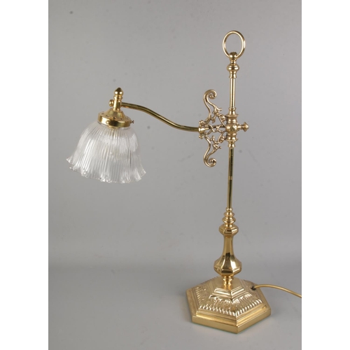 73 - A brass desk lamp with frilled glass shade.