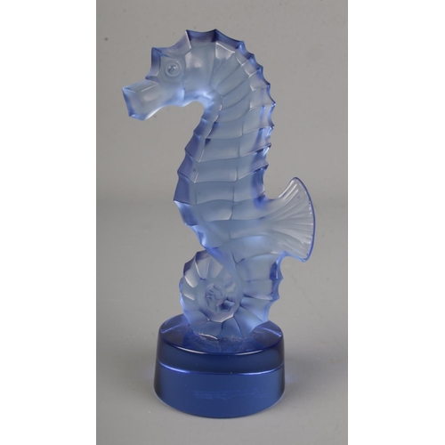 489 - A Lalique blue glass seahorse. 'Lalique France' etched on the base, H10cm.