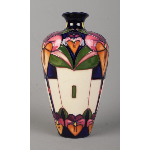 493 - A Moorcroft pottery narrow neck vase in the 'Trilogy' pattern, designed by Rachel Bishop. Bears date... 