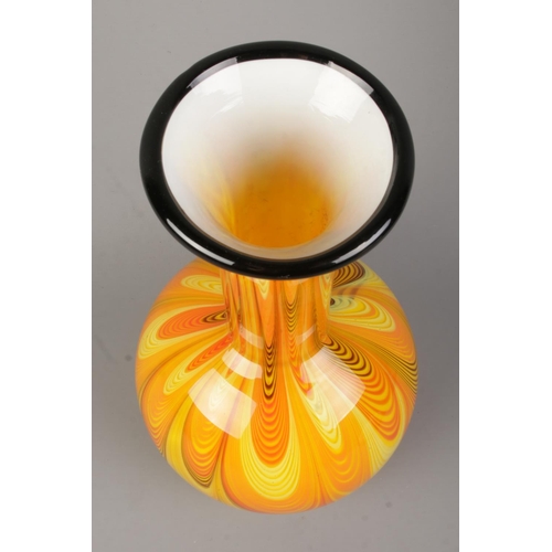 496 - A 1970's Opaline art glass vase, in the style of Carlo Moretti. With orange/yellow swirls and black ... 