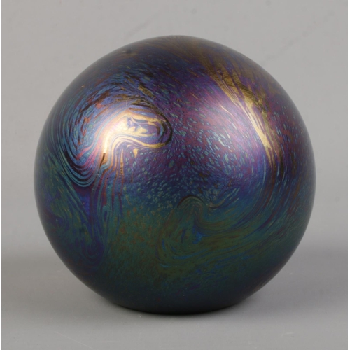 509 - A J. Ditchfield for Glasform iridescent spherical paperweight. Signed and with sticker to base.