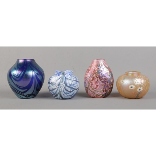 511 - Four Okra art glass vases, including blue pastel, floral and iridescent examples.