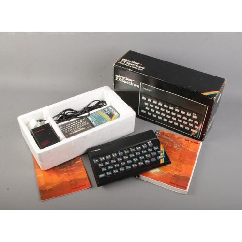 80 - A boxed Sinclair ZX Spectrum personal computer.