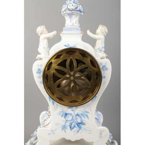 84 - A Nineteenth Century French blue and white ceramic mantle clock on stand, depicting two cherubs surr... 