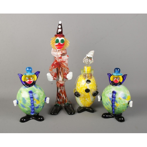 85 - Four Murano style glass clowns, includes decanter example. Largest 43cm.