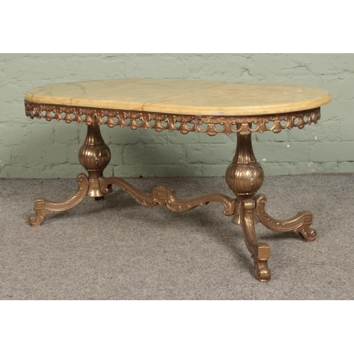 542 - A brass and onyx coffee table, with oval top. Height: 44cm Width: 100cm Depth: 50cm.