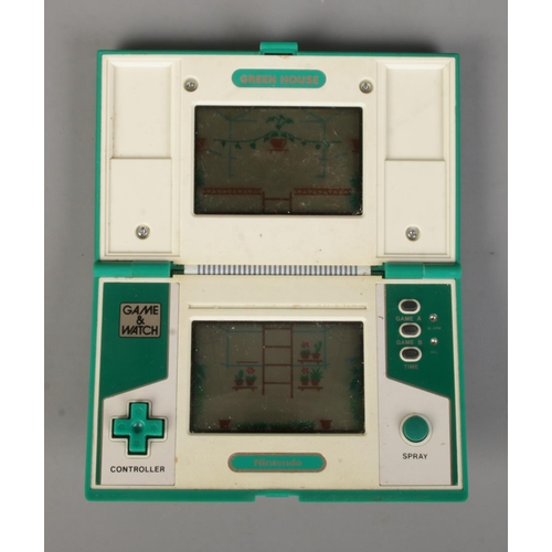 87 - A Nintendo Game & Watch Green House handheld game.