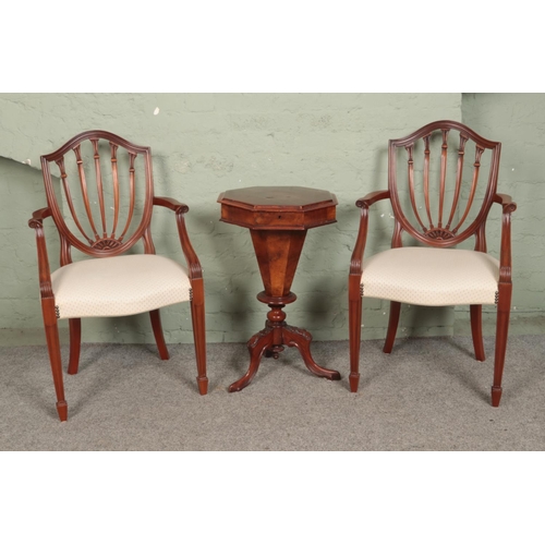 549 - A pair of Hepplewhite style armchairs, together with a Victorian walnut sewing box, on carved tripod... 