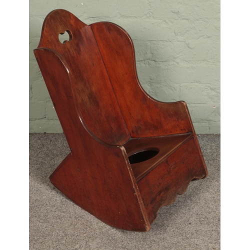 555 - A 19th century child rocking commode chair.