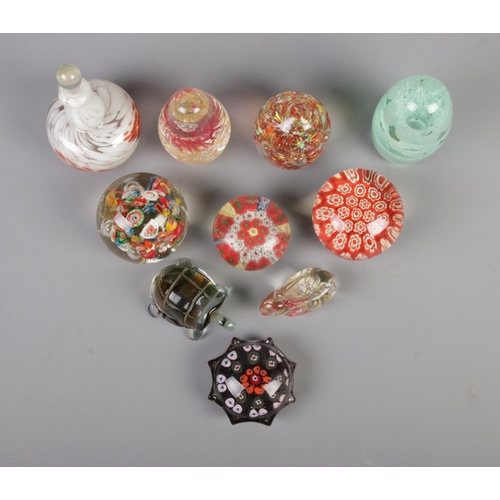 9 - Ten assorted glass paperweights, to include Mdina, Victorian dump, animal and millefiori examples.