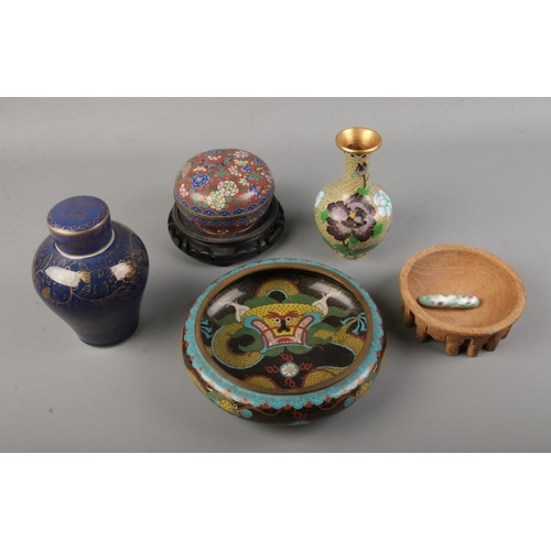 95 - A collection of oriental pieces including large cloisonne dragon bowl and vase, oriental stand, ging... 