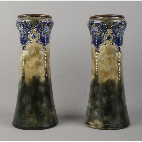 96 - A pair of Royal Doulton blue and olive ground stoneware vases; 6462 pattern. With impressed mark to ... 