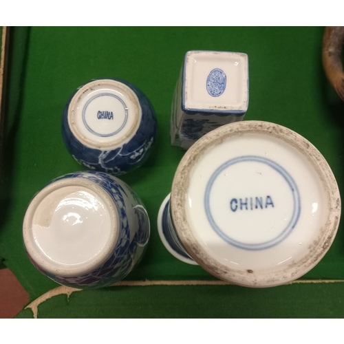 13 - Four pieces of oriental blue and white ceramics, to include tall cylindrical vase (25cm) and ginger ... 