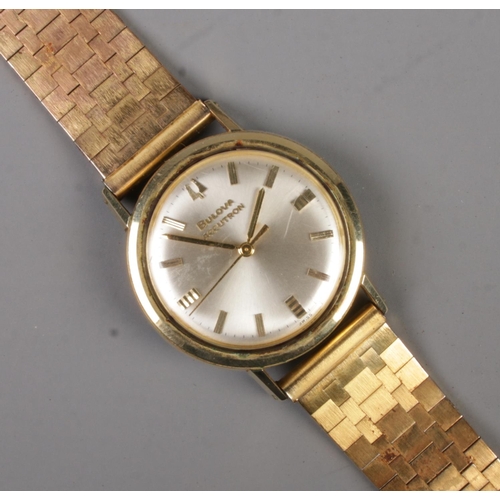 404 - A gents stainless steel Bulova Accutron quartz wristwatch on gold plated strap. With box and papers.