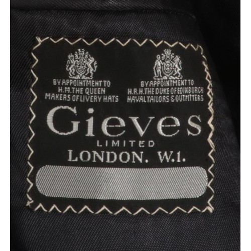 279 - A Royal Navy Lieutenants jacket. Bearing label for Gieves Limited, London.