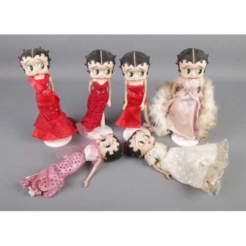 107 - A collection of six Betty Boop figures on stands