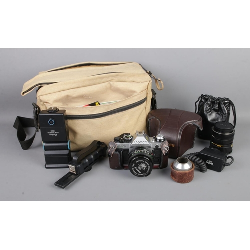 108 - A Canon AE-1 Program 35mm film camera along with a collection of accessories including Canon zoom le... 