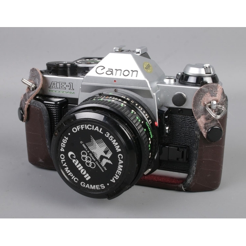 108 - A Canon AE-1 Program 35mm film camera along with a collection of accessories including Canon zoom le... 