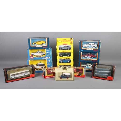 117 - A collection of boxed scale model vehicles, to include examples from Matchbox, Burago and Exclusive ... 