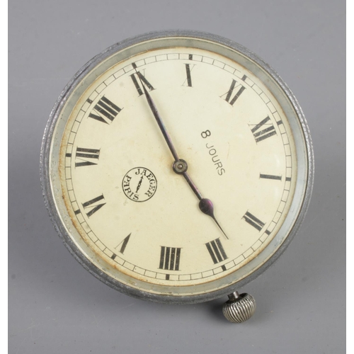 133 - An early 20th century Jaeger 8 Jours car dashboard clock featuring roman numeral face.