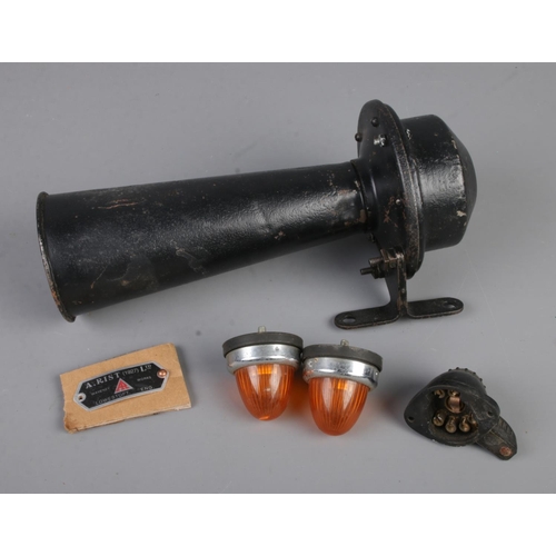 134 - A 1927 A. Rist horn, two amber indicators and one light fitting originally for an Austin 7.