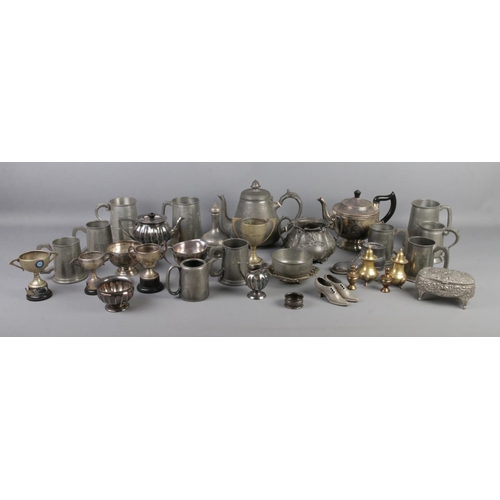 177 - A box of assorted metalwares, to include trophies, lidded jewellery box, teapots, sugar bowls and ta... 