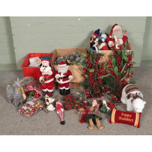 181 - Three boxes of assorted Christmas decorations to include ceramics, battery operated Santa Claus, art... 