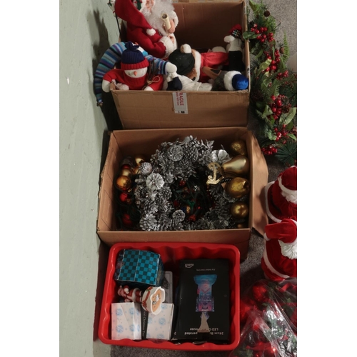 181 - Three boxes of assorted Christmas decorations to include ceramics, battery operated Santa Claus, art... 