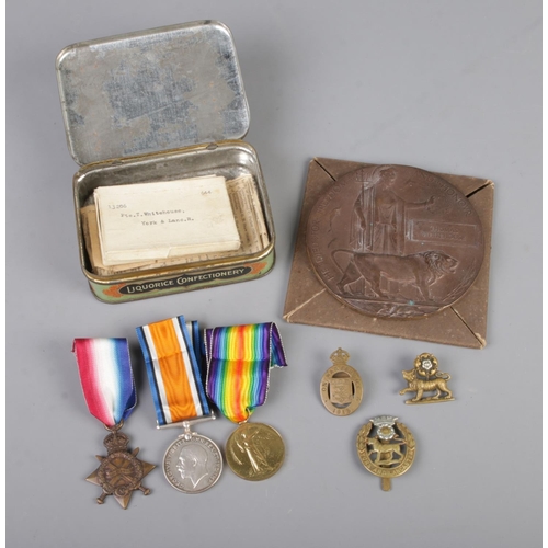 3 - A First World War Memorial/Death Plaque together with medals, cap badges and pins all associated wit... 