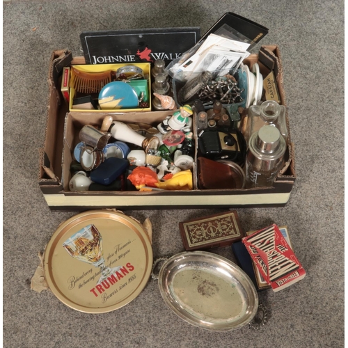 210 - A large box of mixed collectables including various small ceramic figures, vintage lighters, old bot... 