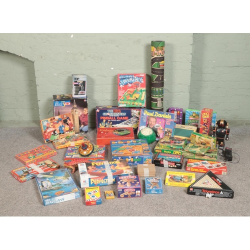 223 - A large assortment of vintage toys and games, to include Chad Valley Escalado, jigsaw puzzles, Brio ... 