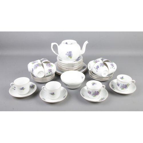 224 - A Victoria china (Czechoslovakia) part tea set including tea pot, cups and saucers, side plates etc