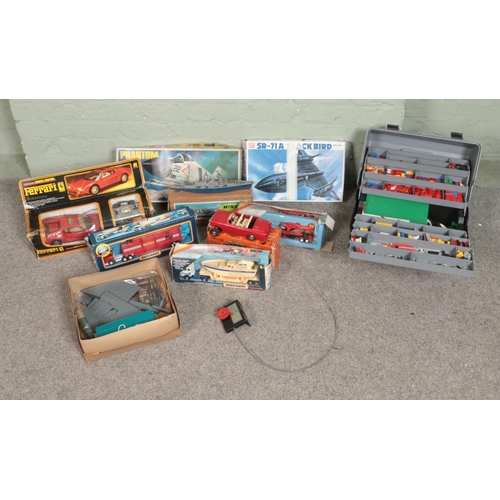 227 - A collection of larger scale model vehicles and kit builds, along with a cantilever box containing L... 