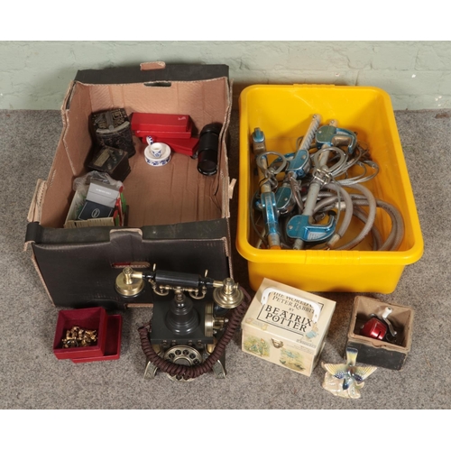 238 - A box of mixed collectables including an antique style phone, Beatrix Potter books, Attwood brooch, ... 