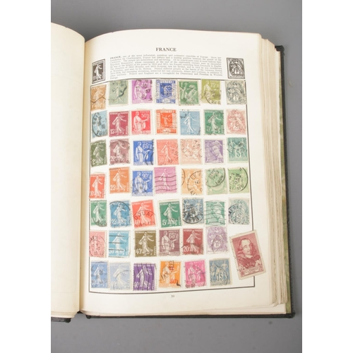 37 - A folder containing the Royal Mail Millennium stamps (2000), together with a Wayfarer stamp album co... 