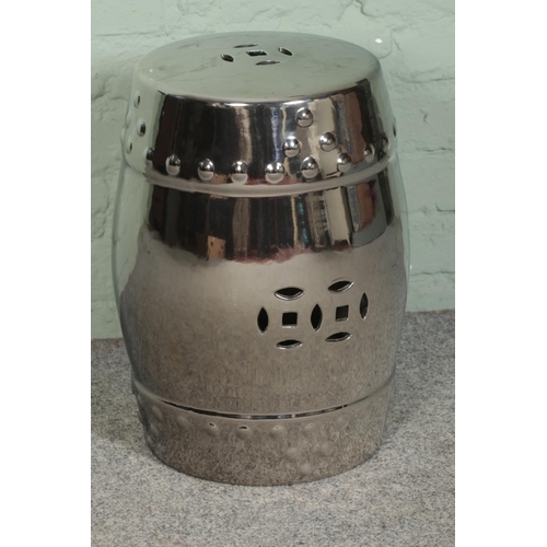 245 - A ceramic barrel stool featuring chrome effect finish. Height: 47cm.