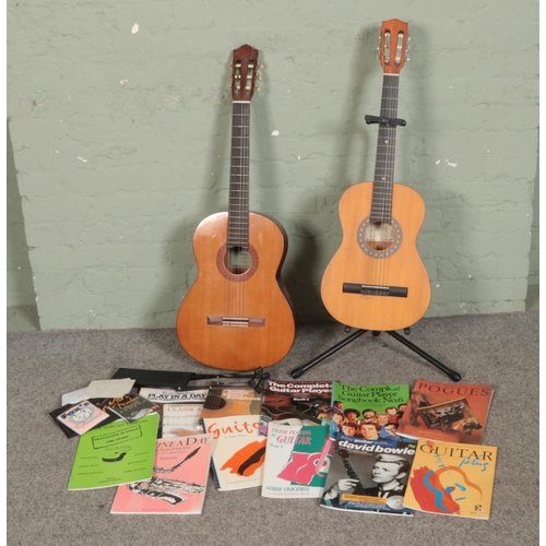 246 - Two classical acoustic guitars including Yamaha C-40 and Encore ENC36N along with stands and small c... 