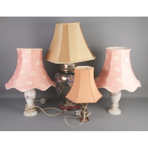 253 - A collection of lamps including a large oriental example