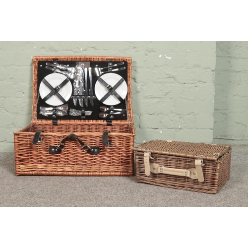 268 - An Optima four place wicker picnic hamper and contents, together with a smaller wicker picnic basket... 