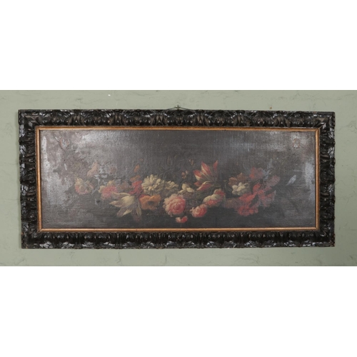 296 - After De Heem oil on canvas depicting display of hanging flowers in black painted carved frame. Appr... 