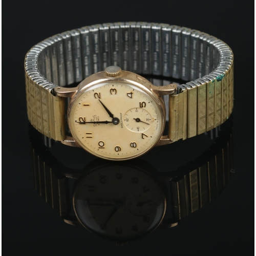 337 - A Smiths 9ct gold cased Deluxe 15 jewels men's wristwatch featuring Arabic numbers and subsidiary se... 