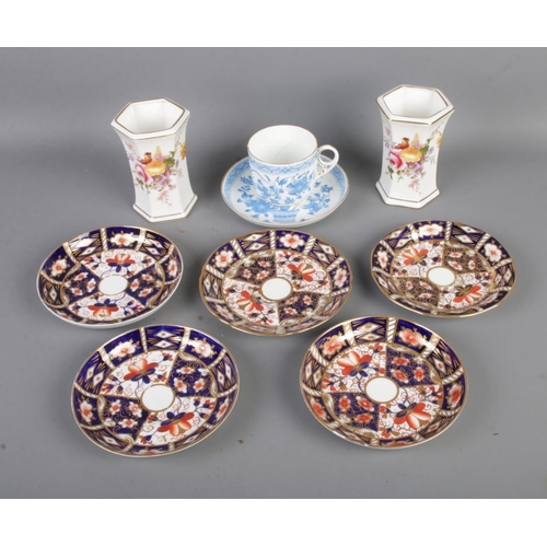 61 - A collection of Royal Crown Derby ceramics to include five saucer in the 2451 pattern, two Derby Pos... 