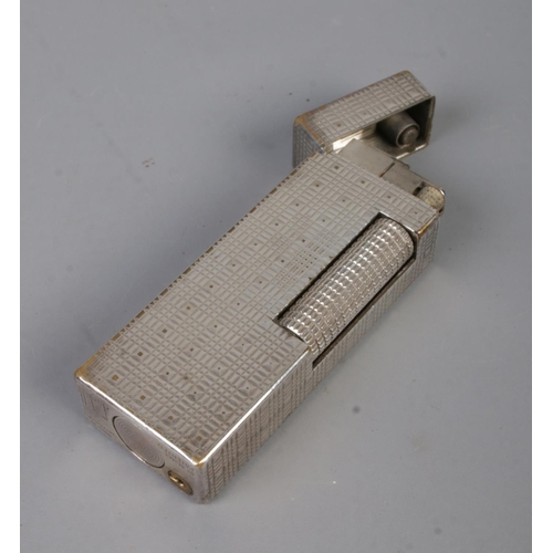 353 - A vintage Dunhill Rollagas lighter, in box with directions leaflet. With chequered pattern, stamped ... 