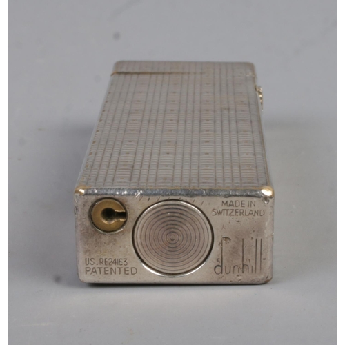 353 - A vintage Dunhill Rollagas lighter, in box with directions leaflet. With chequered pattern, stamped ... 