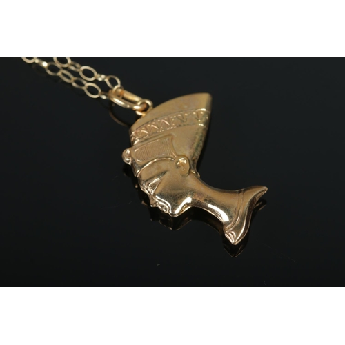 387 - A 9ct Gold pendant formed as Queen Nefertiti, suspended on 9ct necklace chain. Length of chain (doub... 