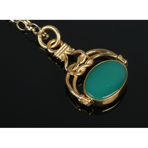 388 - A 9ct Gold onyx and agate swivel fob, on 9ct Gold chain. Total weight: 5.9g.